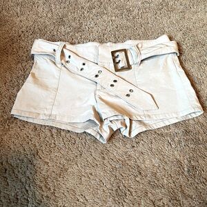 Cream short shorts with belt.